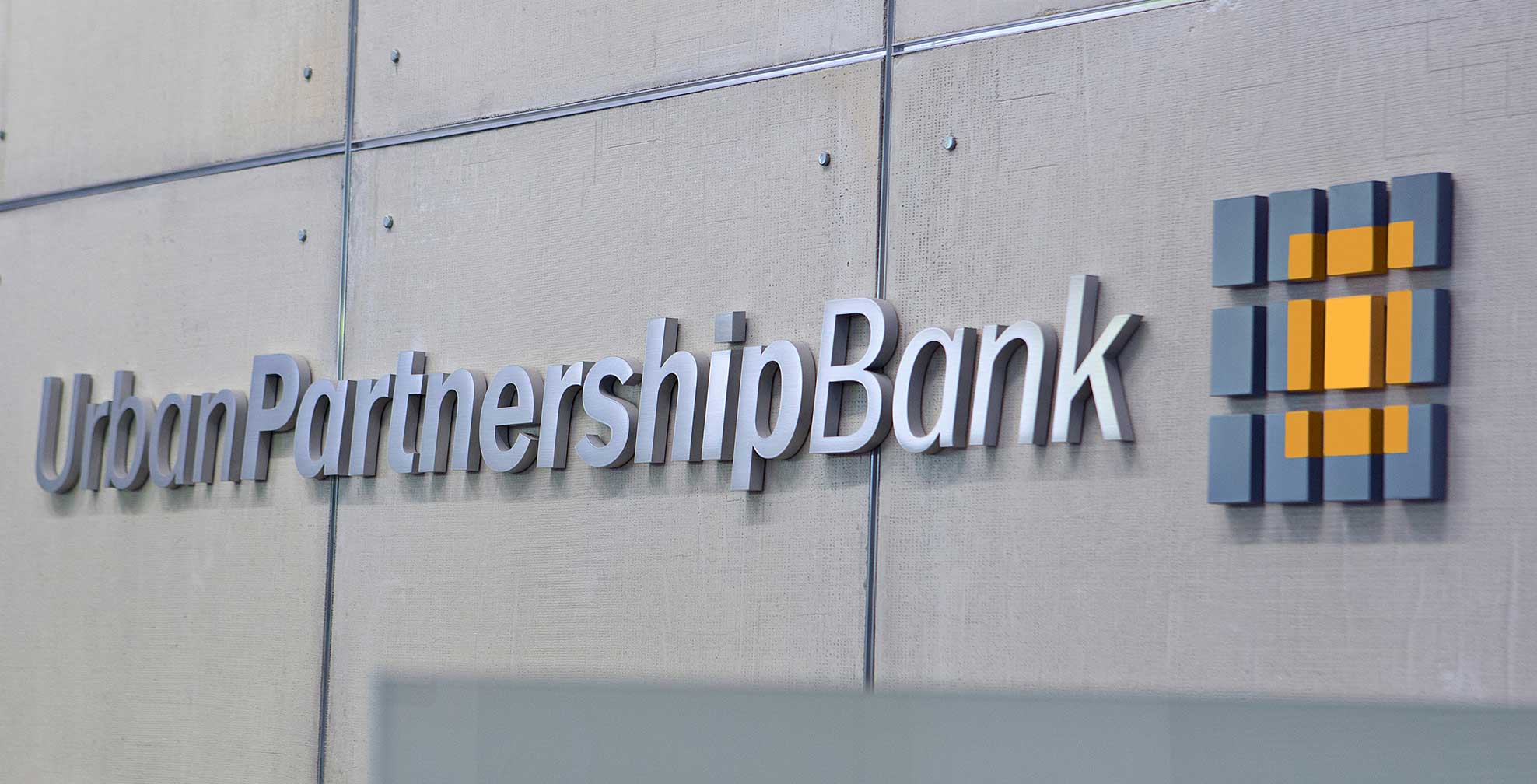 urban-partnership-bank_logo-wall.jpg Art Direction by: Bart Crosby, Crosby Associates